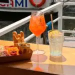 drinks and fingerfood on a boat on the navigli in milan